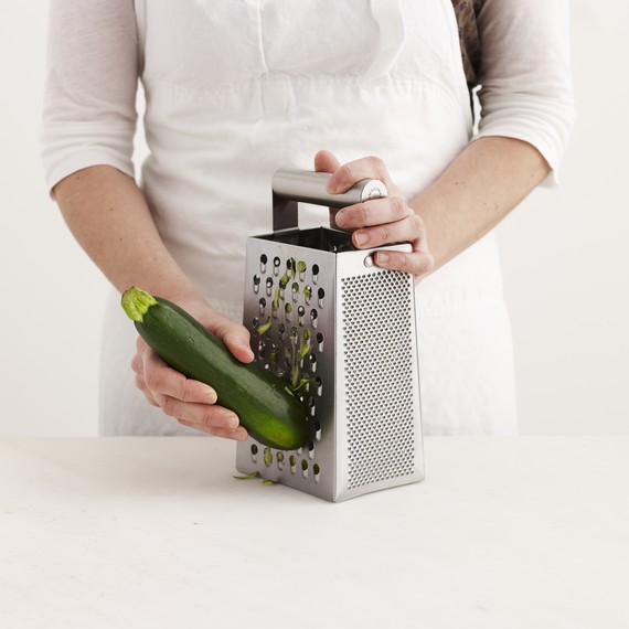 Box grater with zucchini