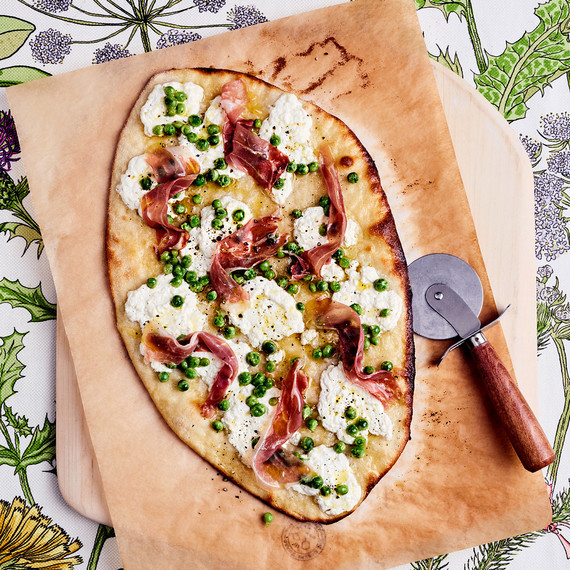 römisch thin-crust pizza with prosciutto, ricotta, and peas